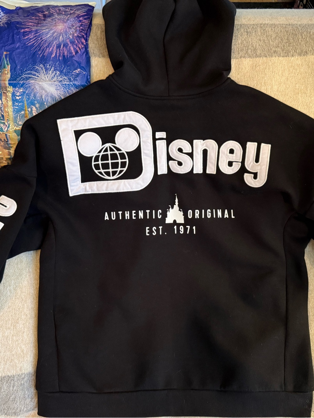 Disney Black Zip-Up Sweater with White Logo and Sleeve Text